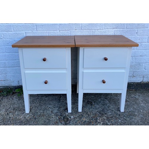 A pair of cream and pine finish bedside chests -