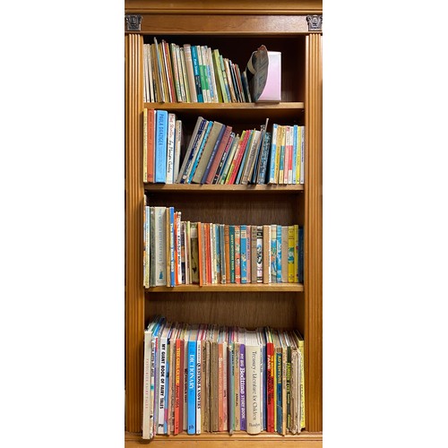 294 - Four shelves of books, mostly childrens, annuals, Enid Blyton, etc -