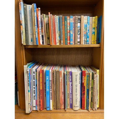 294 - Four shelves of books, mostly childrens, annuals, Enid Blyton, etc -