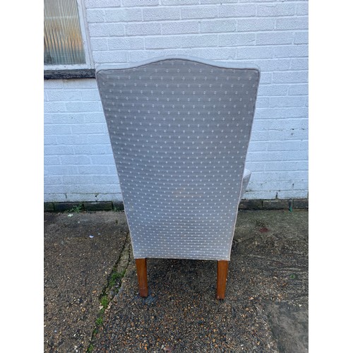 470 - An 18th Century style armchair, with high back, outswept arms, and short cabriole legs -