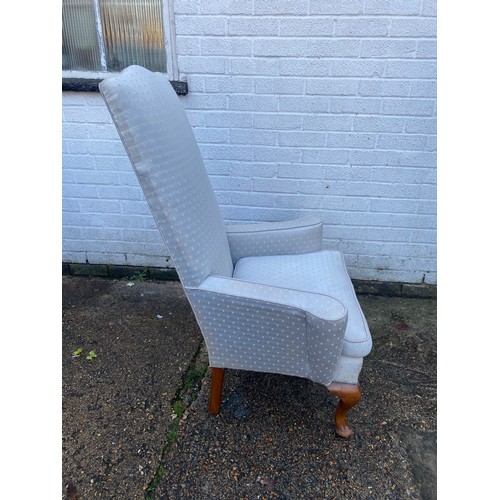 470 - An 18th Century style armchair, with high back, outswept arms, and short cabriole legs -