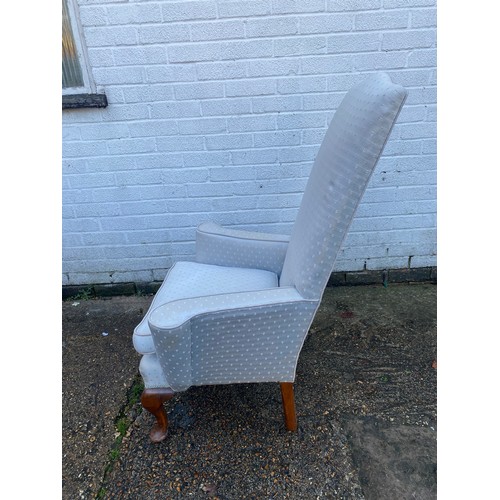 470 - An 18th Century style armchair, with high back, outswept arms, and short cabriole legs -