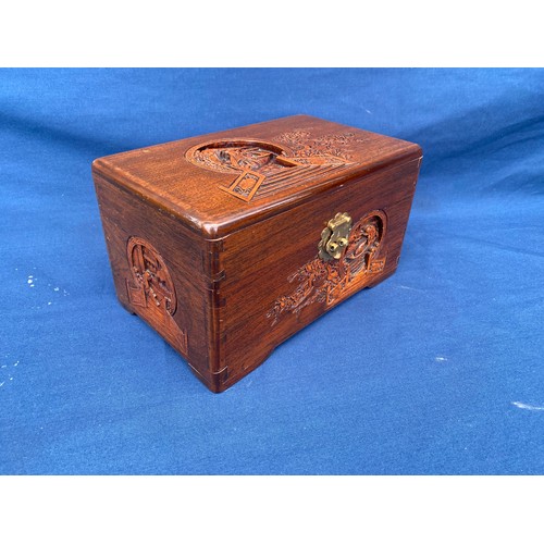 161 - An eastern carved table top box, carved with boating scenes and landscapes -