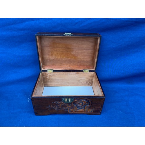 161 - An eastern carved table top box, carved with boating scenes and landscapes -