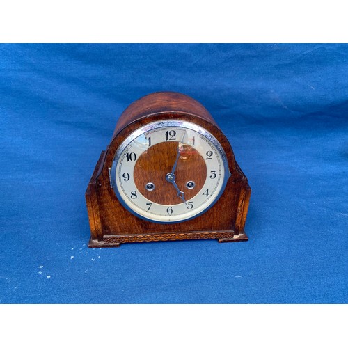 396 - An oak cased mantle clock -