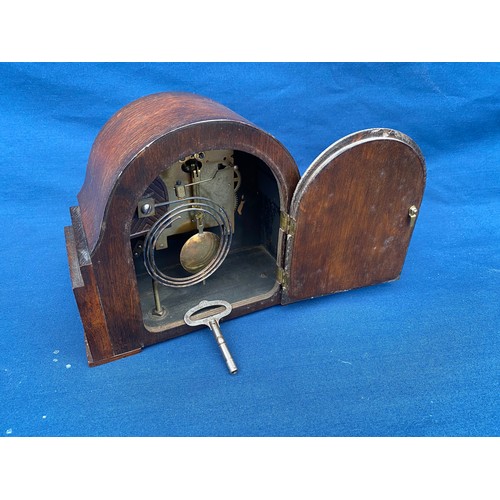 396 - An oak cased mantle clock -