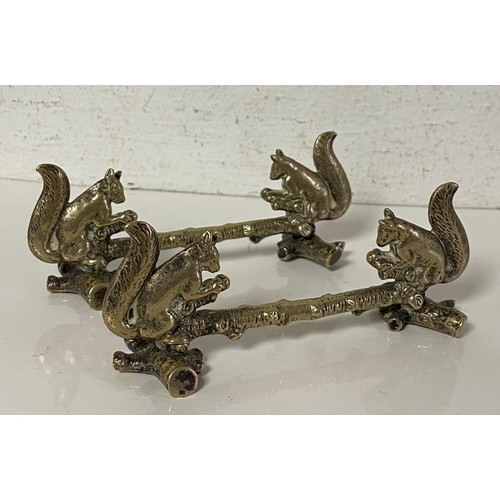 43 - A pair of silver plated knife rests, each with squirrel supports -
