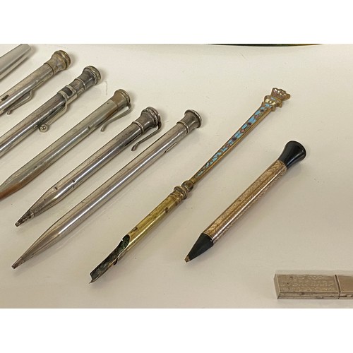 330 - A group of pens and pencils, to include a champleve enamel dip pen and silver propelling pencil -