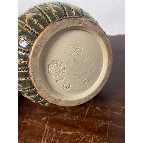 207 - A Doulton Lambeth stoneware vase, decorated with bands of leaves and flowerheads -