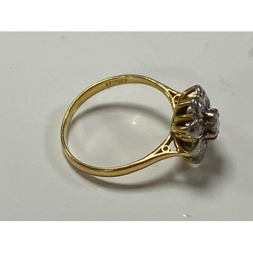67 - A diamond cluster ring, of flowerhead design, set in 18ct gold -