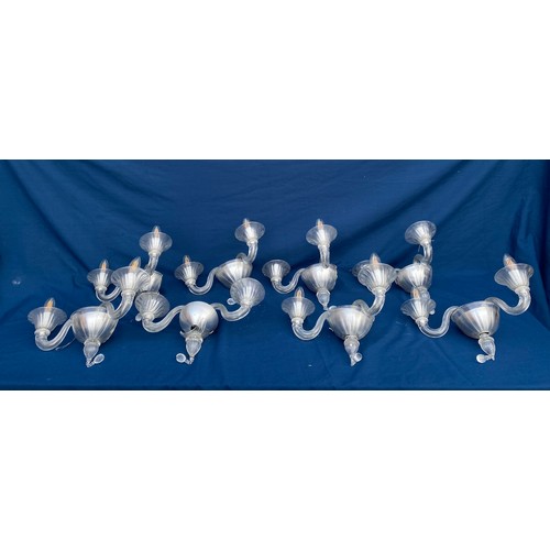 403 - A glass four branch chandelier, together with 8 matching twin branch wall lights (one a/f) each piec... 