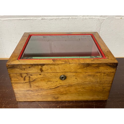 A Victorian table top cabinet, with glass inset top and lined interior -