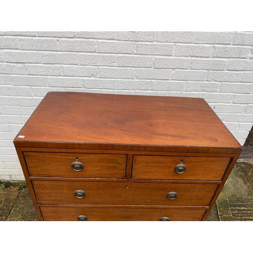 411 - A Georgian mahogany chest of drawers, fitted with two short over three long drawers -