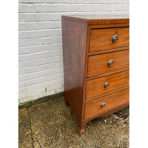 411 - A Georgian mahogany chest of drawers, fitted with two short over three long drawers -