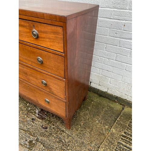 411 - A Georgian mahogany chest of drawers, fitted with two short over three long drawers -