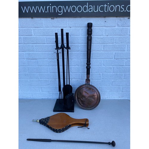 358 - A companion set together with a pair of bellows and a warming pan -