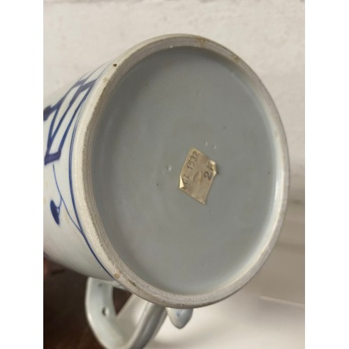 237 - An 18th Chinese tankard, from the Nanking cargo chipped, cracked -