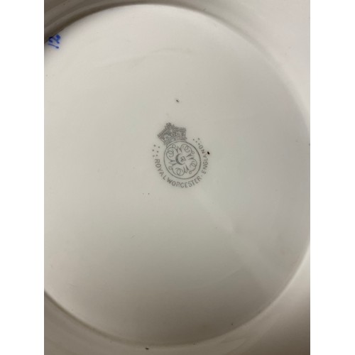 240 - A large Royal Worcester two handled loving cup, painted with flowers on a blush ground, with gilded ... 