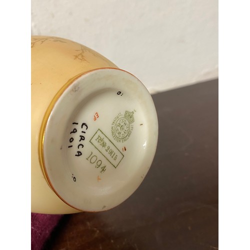 240 - A large Royal Worcester two handled loving cup, painted with flowers on a blush ground, with gilded ... 