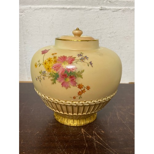 240 - A large Royal Worcester two handled loving cup, painted with flowers on a blush ground, with gilded ... 