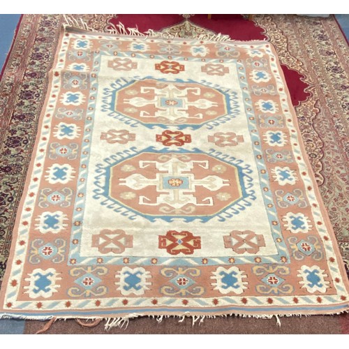 439 - A large Turkish wool carpet, worked in peach and cream approximately, 230 x 170 cm -