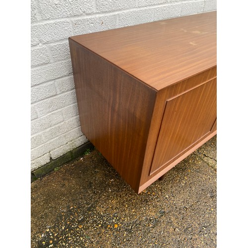 440 - A vintage teak sideboard, fitted with a pair of cupboard doors, five graduated drawers and a pull do... 