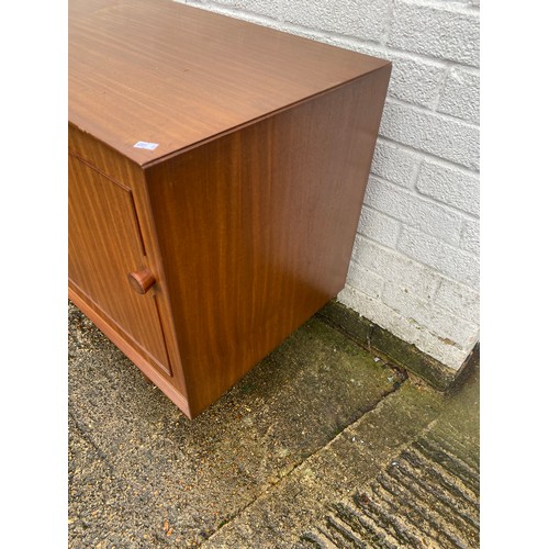 440 - A vintage teak sideboard, fitted with a pair of cupboard doors, five graduated drawers and a pull do... 