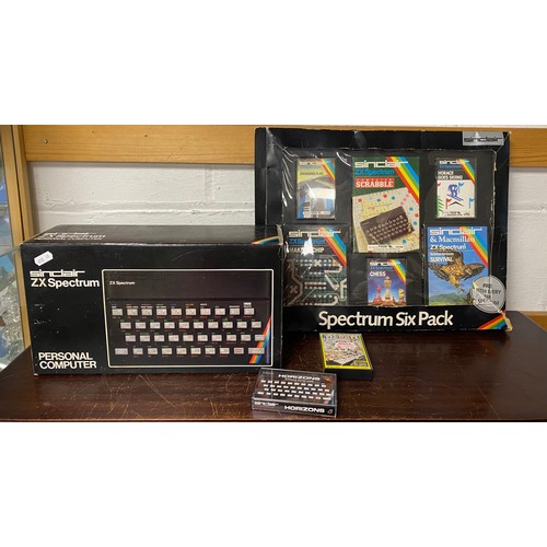 A vintage Sinclair ZX Spectrum 48k personal computer and six pack of ...