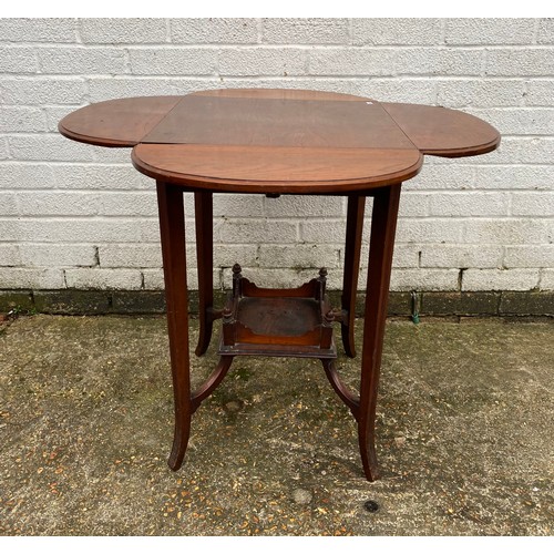 457 - An occasional table with four drop sides and undertier -