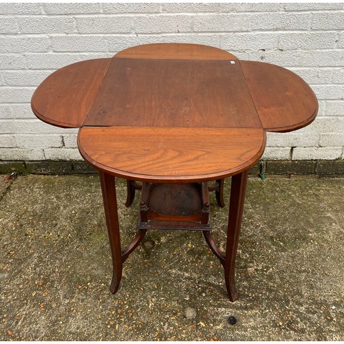 457 - An occasional table with four drop sides and undertier -
