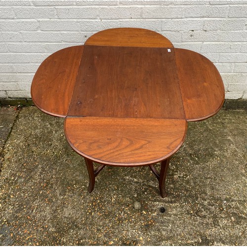 457 - An occasional table with four drop sides and undertier -