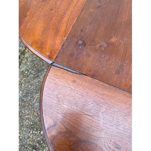 457 - An occasional table with four drop sides and undertier -