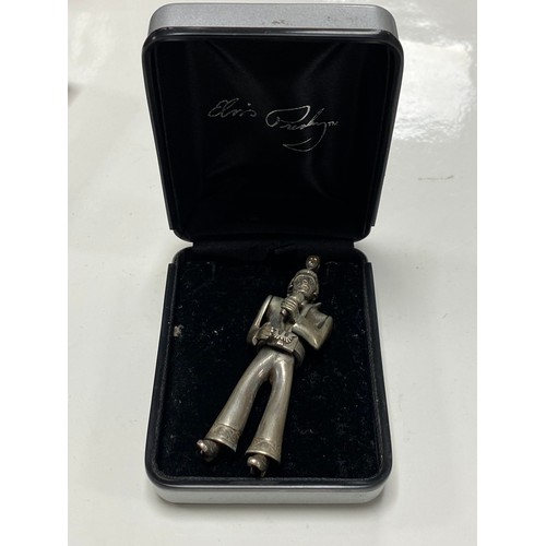 178 - A modern silver articulated Elvis Presley pendant, boxed -