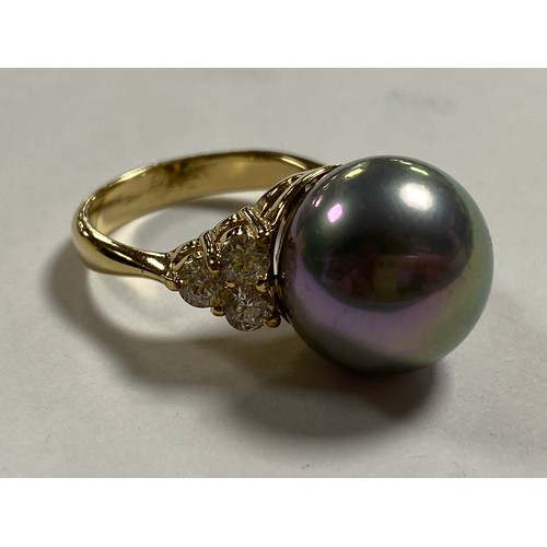 179 - A modern silver gilt dress ring set with a faux pearl between CZ -