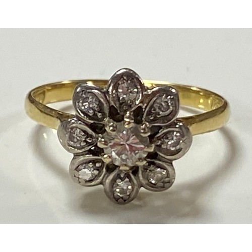 180 - A diamond cluster ring, of flowerhead design, set in 18ct gold -