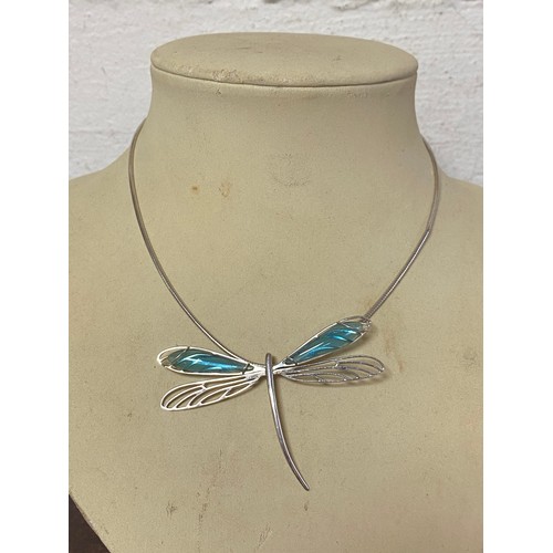 128 - A contemporary silver and glass pendant, by Lalique , designed as a dragonfly with glass wings -