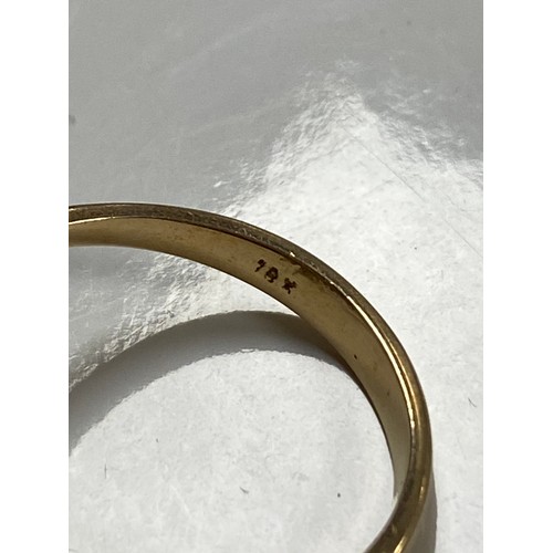 144 - An opal set dress ring, the large oval cabochon in a border of clear stones (1 missing) in 18 carat ... 