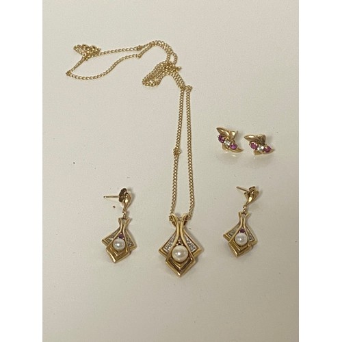 A 9ct gold necklace and earring suite, each piece set with ruby, pearl and diamond points and  another pair of earrings -