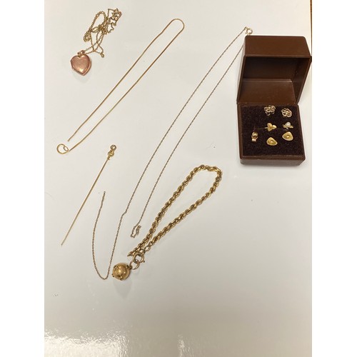 163 - A gold sputnik style charm, a puffy heart locket on chain, assorted earrings and broken chain -
