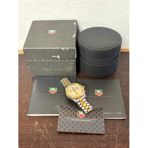 27 - A Tag Heuer Chronograph wristwatch, with white dial and bi-coloured bezel and strap, boxed with pape... 
