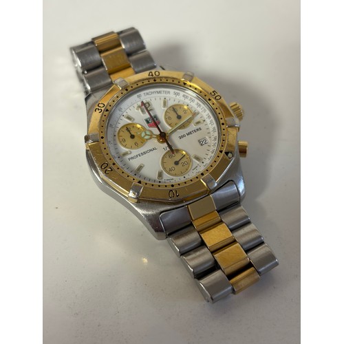 27 - A Tag Heuer Chronograph wristwatch, with white dial and bi-coloured bezel and strap, boxed with pape... 