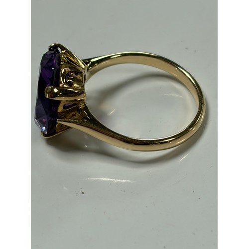 31 - A 14ct gold dress ring, set with a synthetic colour change stone, mount stamped 14k 585 -