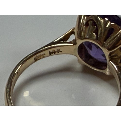 31 - A 14ct gold dress ring, set with a synthetic colour change stone, mount stamped 14k 585 -