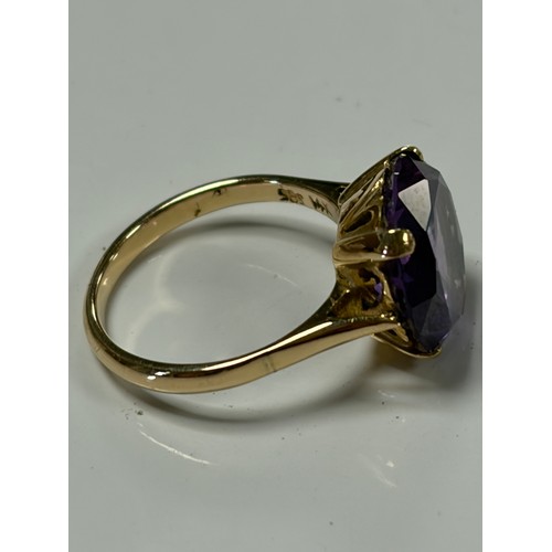 31 - A 14ct gold dress ring, set with a synthetic colour change stone, mount stamped 14k 585 -