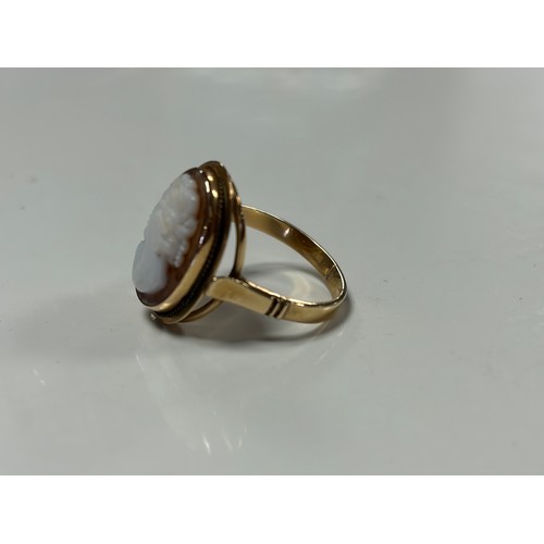 34 - A cameo ring, with carved shell cameo in yellow metal mount -