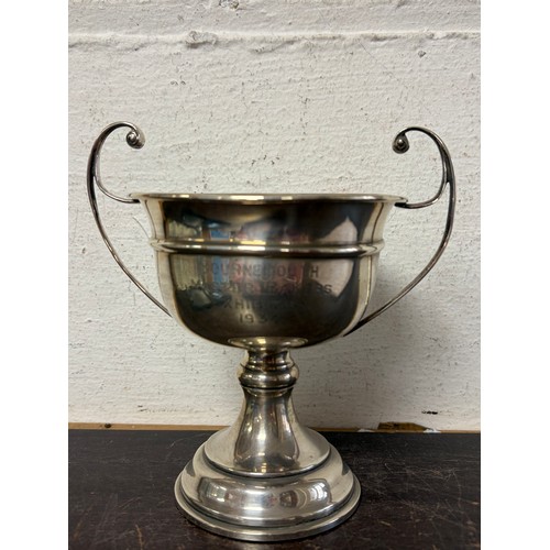 36 - A George V silver trophy cup, Birmingham 1934, with twin handles, presentation inscription for Bourn... 
