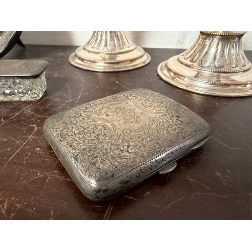 38 - An Edwardian silver cigarette case, Birmingham 1901, together with a silver covered trinket box, a c... 