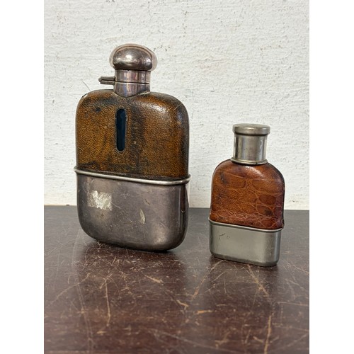 41 - An Edwardian spirit flask, with plated mount and another similar smaller example -