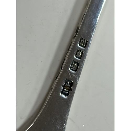 51 - An Irish silver spoon, Dublin 1869, together with another silver spoon -