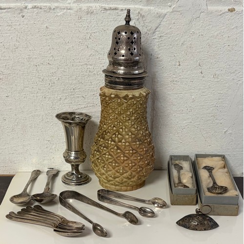 60 - A small quantity of silver items, various dates and makers, to include a silver mounted caster, two ... 